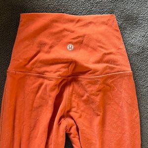 Lulu lemon yoga pants. Red, orange color
